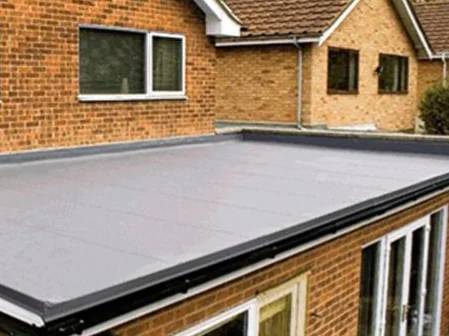 A completed grey GRP fibreglass flat roof on a domestic extension