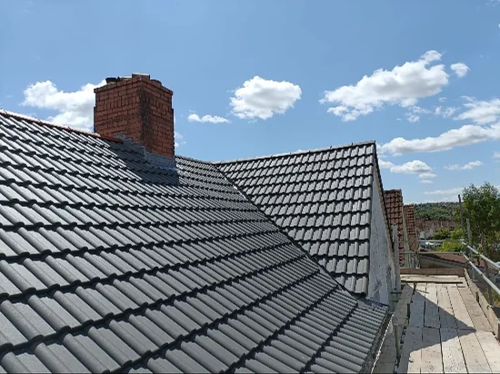 Completed dark tiled roof and repointed chimney stack